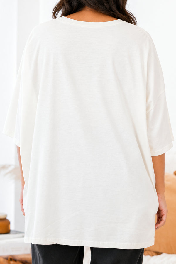 Chic Soul Plus size clothing, ivory graphic tee that has a cartoon goose with a witch hat and bats graphic in the middle of the shirt