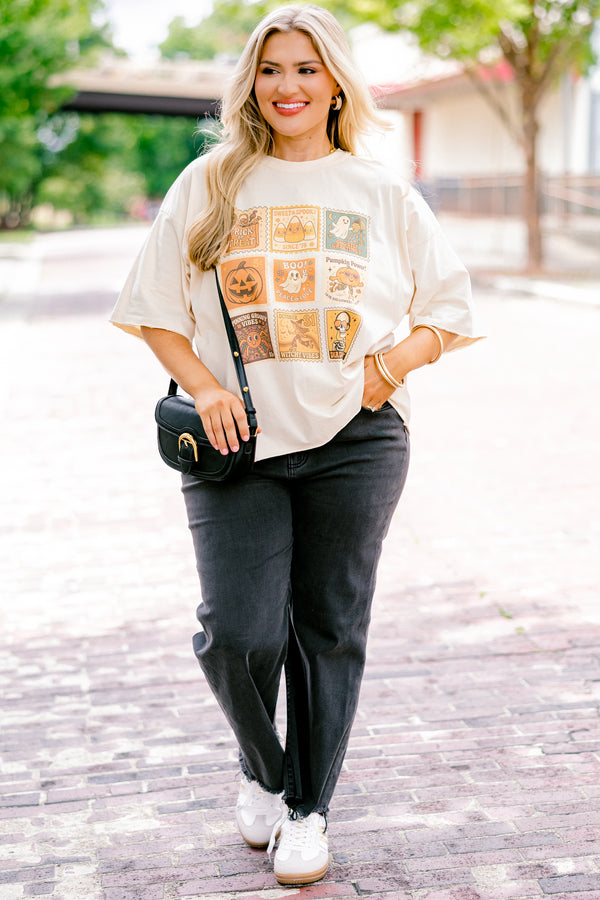 Chic Soul plus size clothing, off white, half sleeve boxy oversized tee with Halloween themed stamps on the front in shades of orange with designs like candy corn, ghosts, pumpkins, witches, and skulls