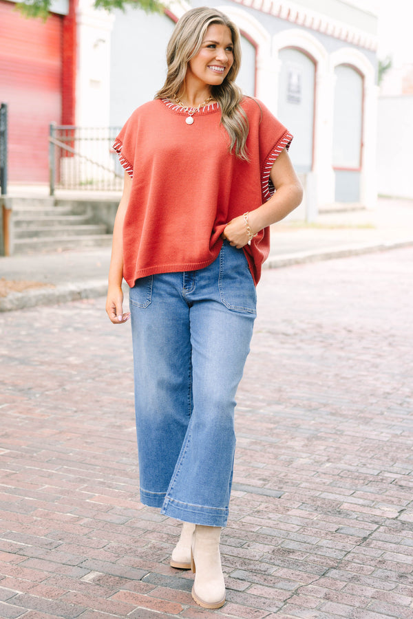 Plus Size medium wash wide-leg cropped jeans with functional pockets and a relaxed fit.