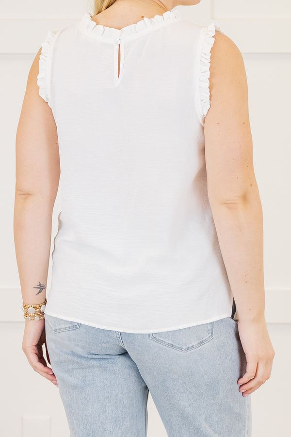 Plus Size ivory sleeveless top with a ruffled high neckline and matching ruffle trim at the armholes.
