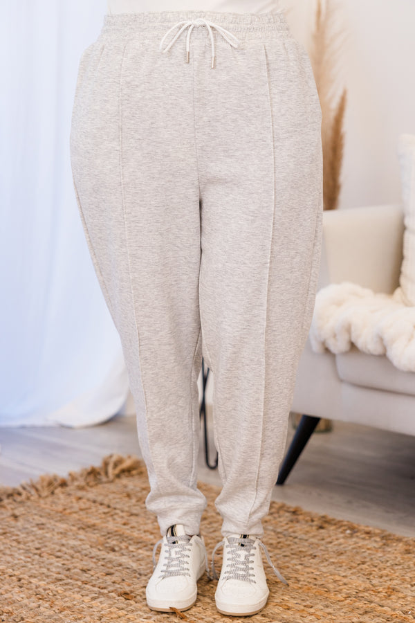 Chic Soul plus size clothing, high-waisted heather grey comfy joggers with inside-out stitching detailing and elastic waistband with white waist-tie