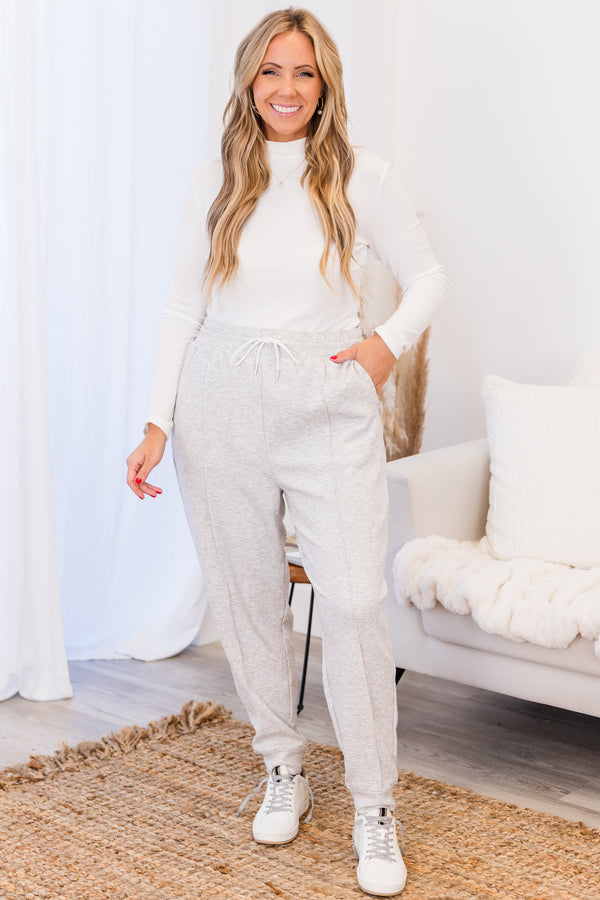 Chic Soul plus size clothing, high-waisted heather grey comfy joggers with inside-out stitching detailing and elastic waistband with white waist-tie