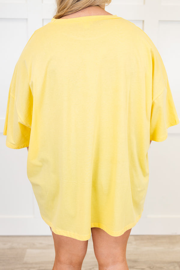 Plus Size butter yellow oversized boyfriend tee with a sunset graphic and crew neckline.
