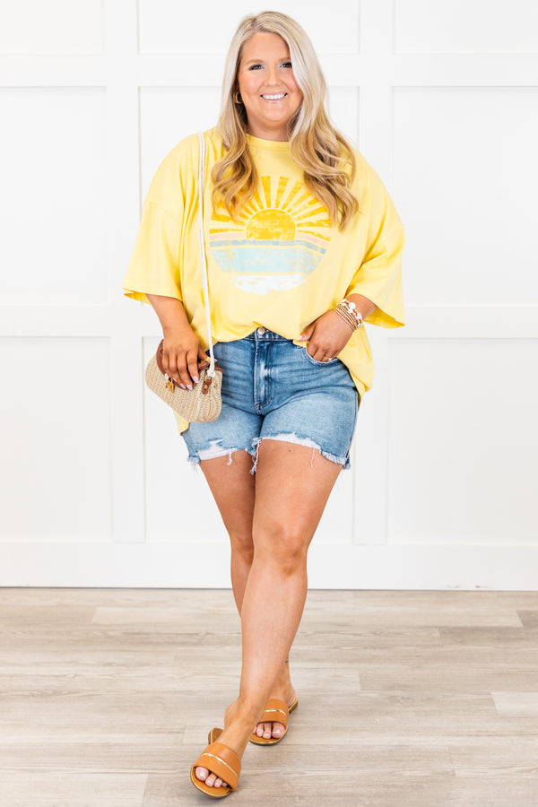 Plus Size butter yellow oversized boyfriend tee with a sunset graphic and crew neckline.