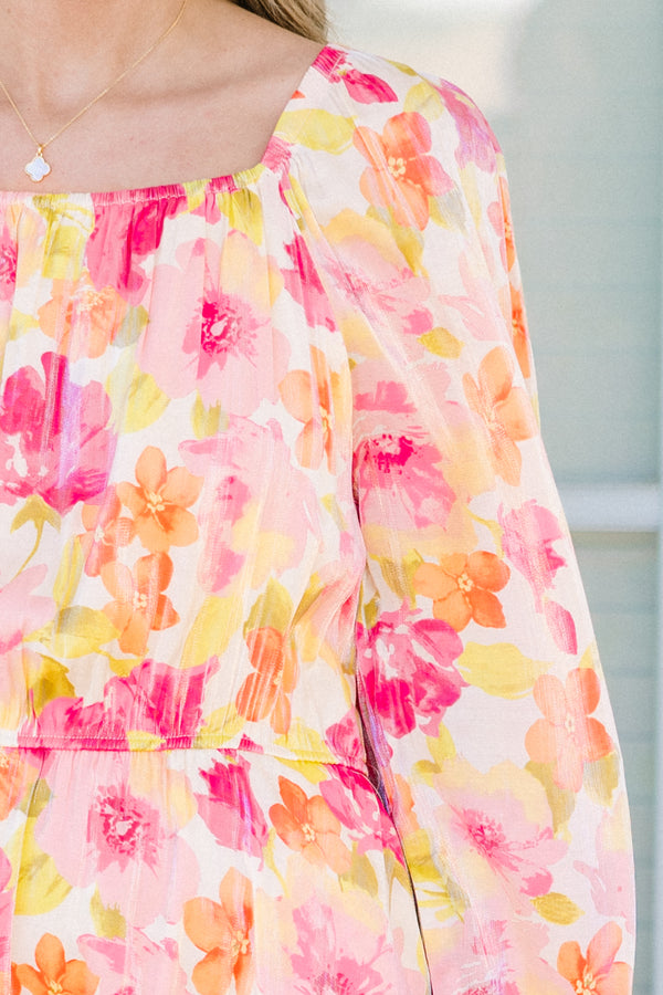 Plus Size pink floral square neck dress with long peasant sleeves and a tiered skirt.