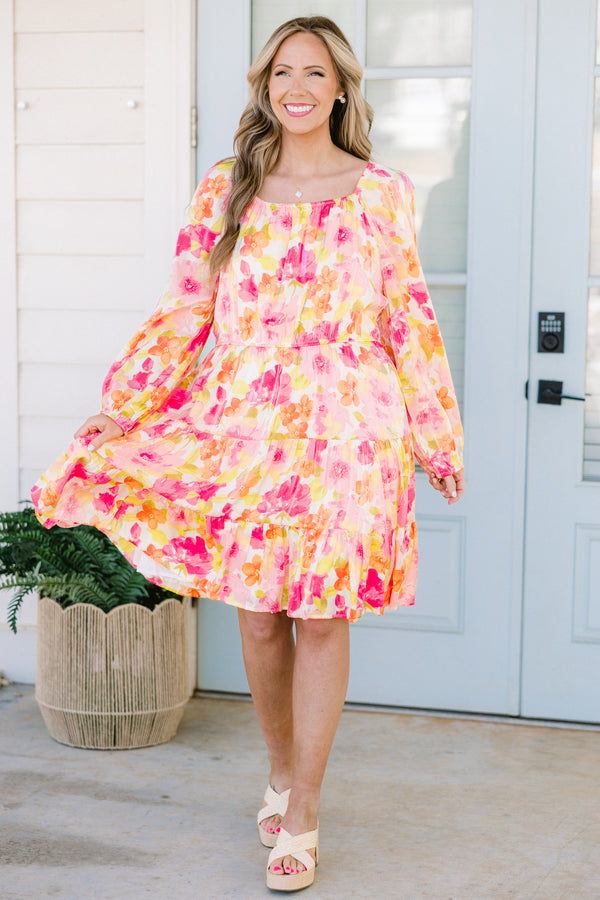 Plus Size pink floral square neck dress with long peasant sleeves and a tiered skirt.