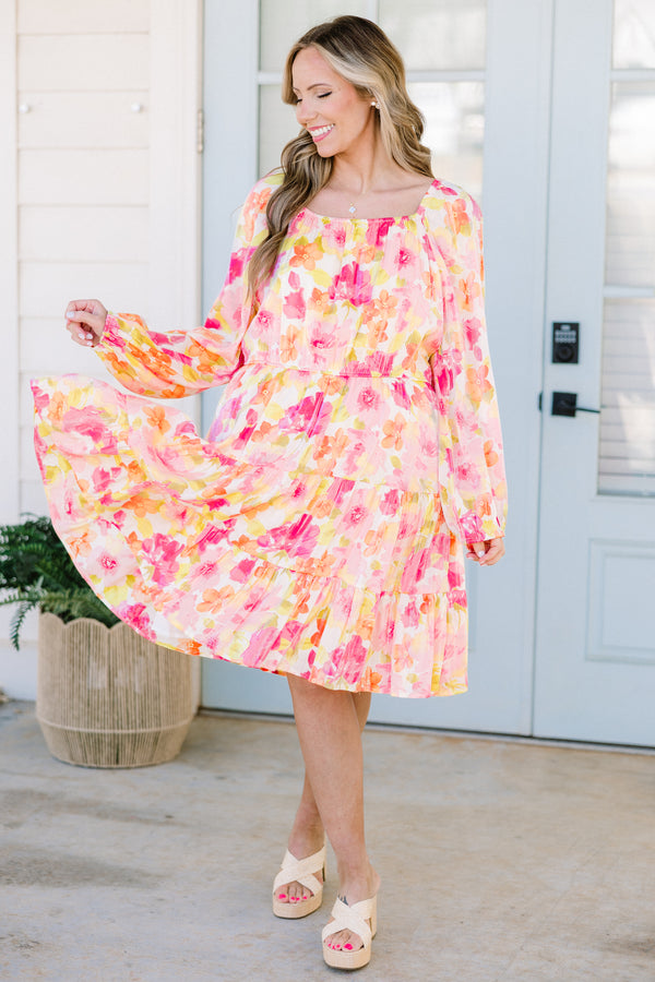 Plus Size pink floral square neck dress with long peasant sleeves and a tiered skirt.