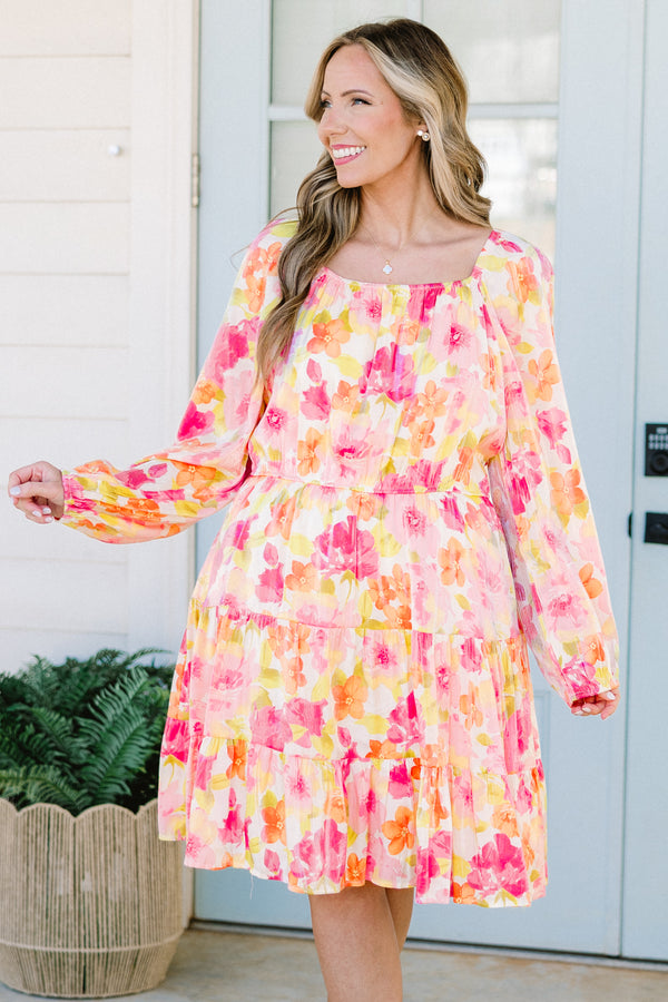 Plus Size pink floral square neck dress with long peasant sleeves and a tiered skirt.