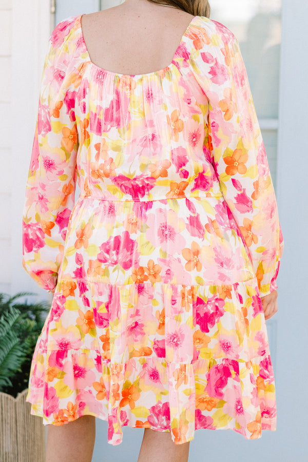 Plus Size pink floral square neck dress with long peasant sleeves and a tiered skirt.
