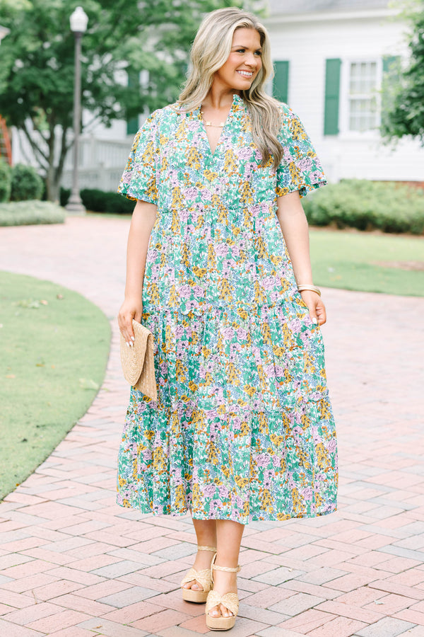 Plus Size cream floral tiered maxi dress with short flutter sleeves and a V-neckline.
