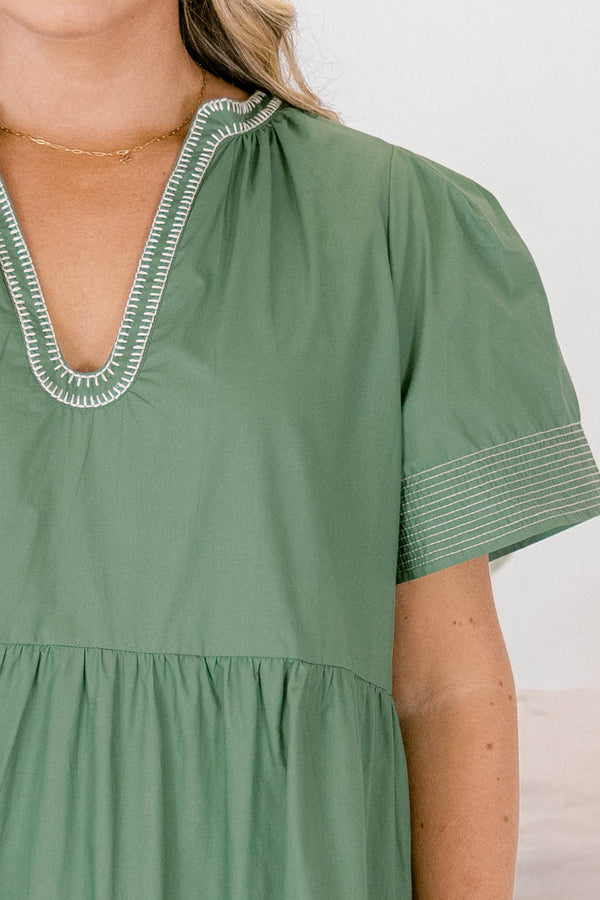Chic Soul plus size clothing, muted sage green short sleeve v neck tiered maxi dress with white stitching detailing on the neckline