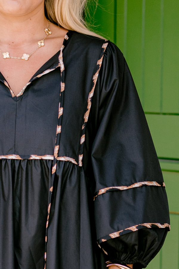 Chic Soul plus size clothing, black dress with long bubble sleeves and cheetah print stitching details on the tiers of the dress sleeves and neckline 