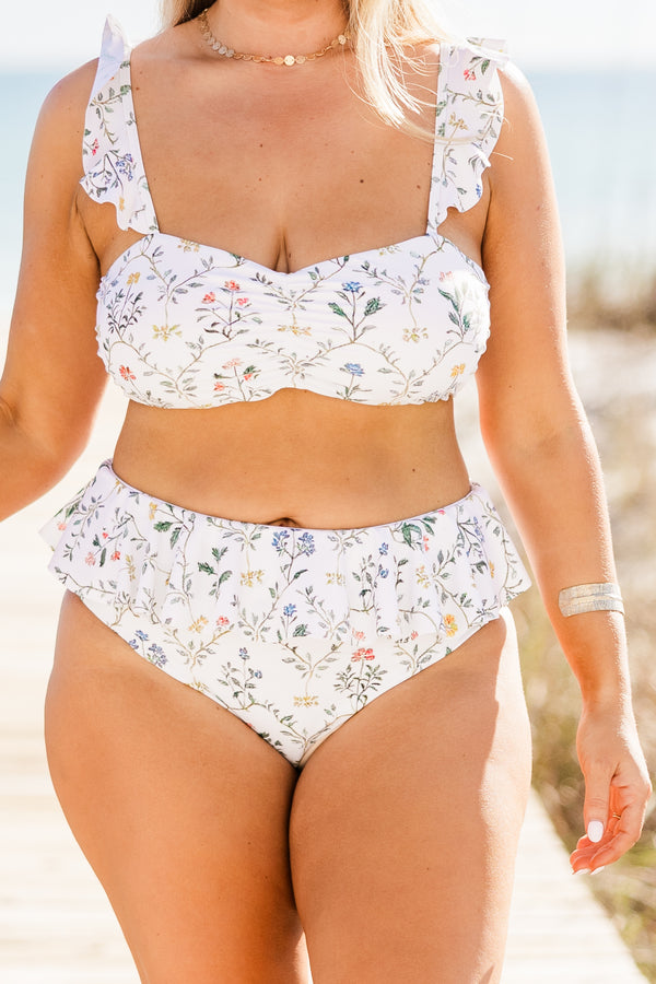 Chic Soul plus size clothing, high-waisted white swim bottom with a ruffled lining and a white multi-colored floral pattern 