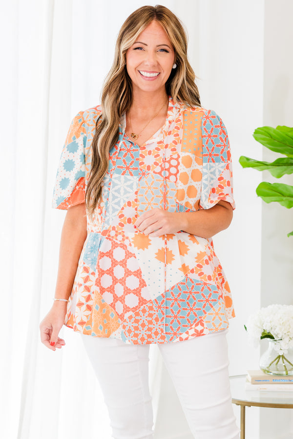 Chic Soul plus size clothing, orange short sleeve geometric multi pattern top with v neckline with tie detail
