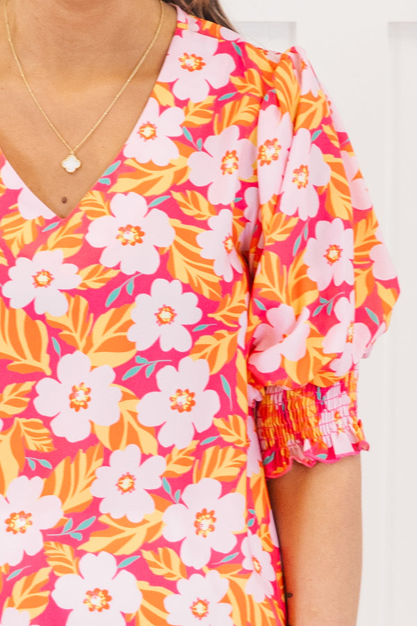 Chic Soul plus size clothing, hot pink short sleeve top with v neckline and smocked cuff sleeves with large multi floral print