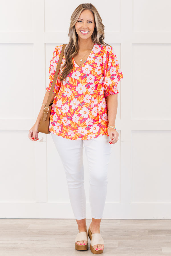 Chic Soul plus size clothing, hot pink short sleeve top with v neckline and smocked cuff sleeves with large multi floral print