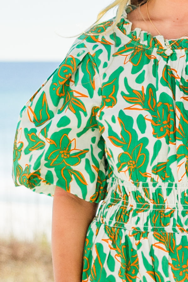 Chic Soul plus size clothing, short-puffed-sleeve green maxi dress with a scoop-neckline and smocked detailing on the waistline with a green and white tropical floral pattern 