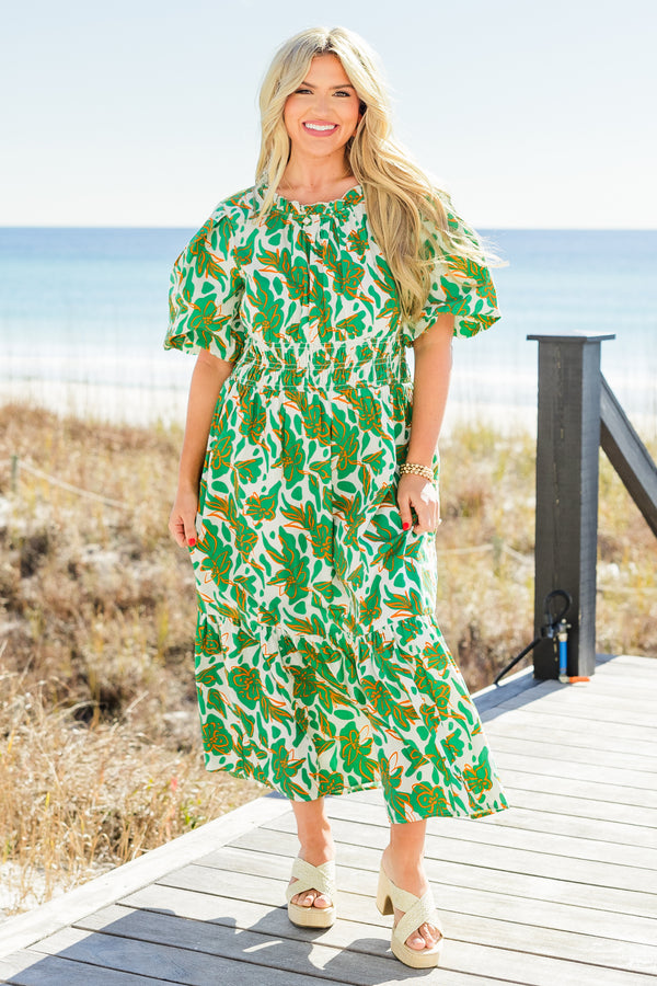 Chic Soul plus size clothing, short-puffed-sleeve green maxi dress with a scoop-neckline and smocked detailing on the waistline with a green and white tropical floral pattern 