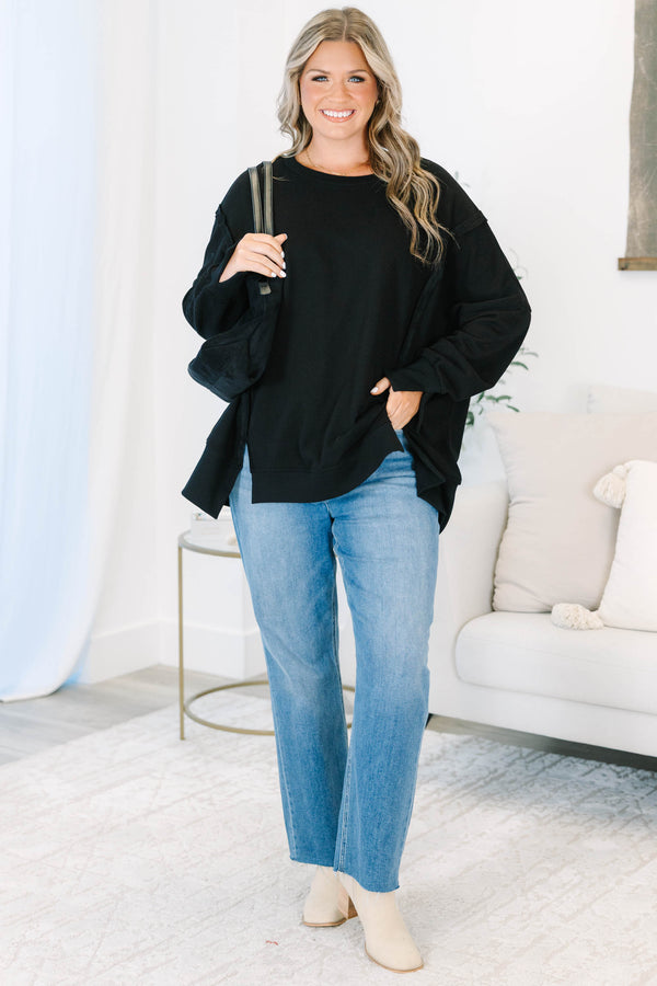 Plus size Sunset Glow Pullover in black, featuring a relaxed fit, crew neck, and raw seam details.