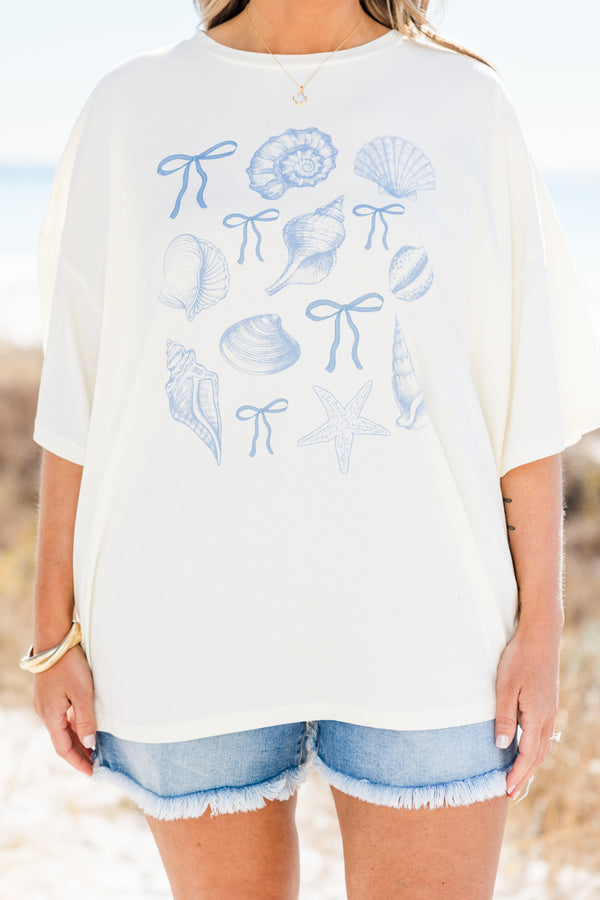 Chic Soul plus size clothing, short-sleeve ivory boyfriend tee with a high-scoop neckline and a light blue graphic art pattern of bows and seashells