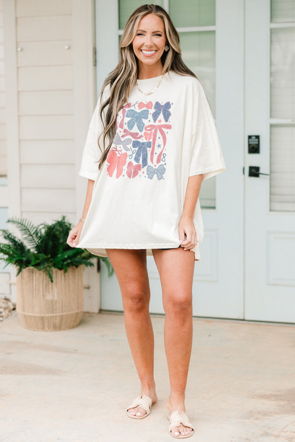 Chic Soul plus size clothing, short-sleeve ivory white boyfriend tee with a high-scoop-neckline and a red and blue faded graphic of different kinds of bows