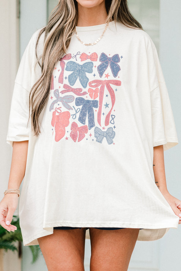 Chic Soul plus size clothing, short-sleeve ivory white boyfriend tee with a high-scoop-neckline and a red and blue faded graphic of different kinds of bows