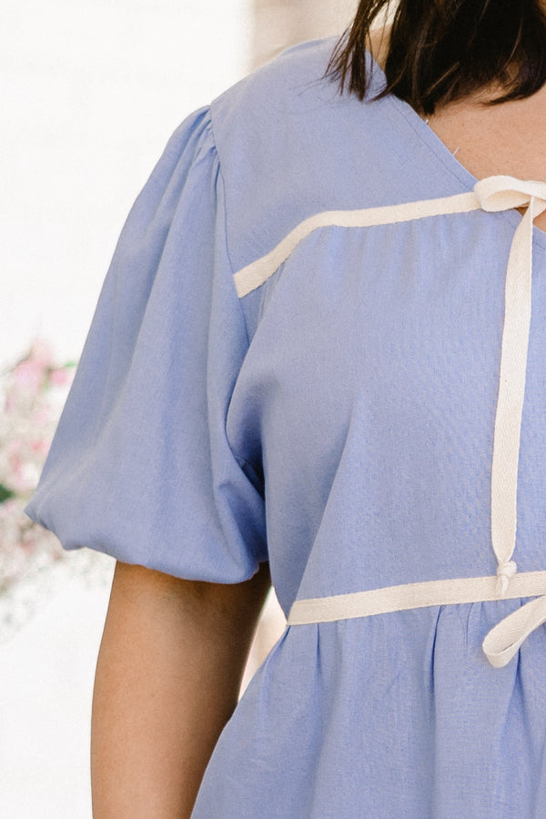 chic soul plus size clothing, sky blue top with white tie bow accents on the neckline and waist area with bubble sleeves 