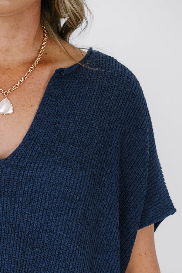 Plus size navy blue knit Sweet Escape Sweater with a flowy fit, V-neckline, and short sleeves.