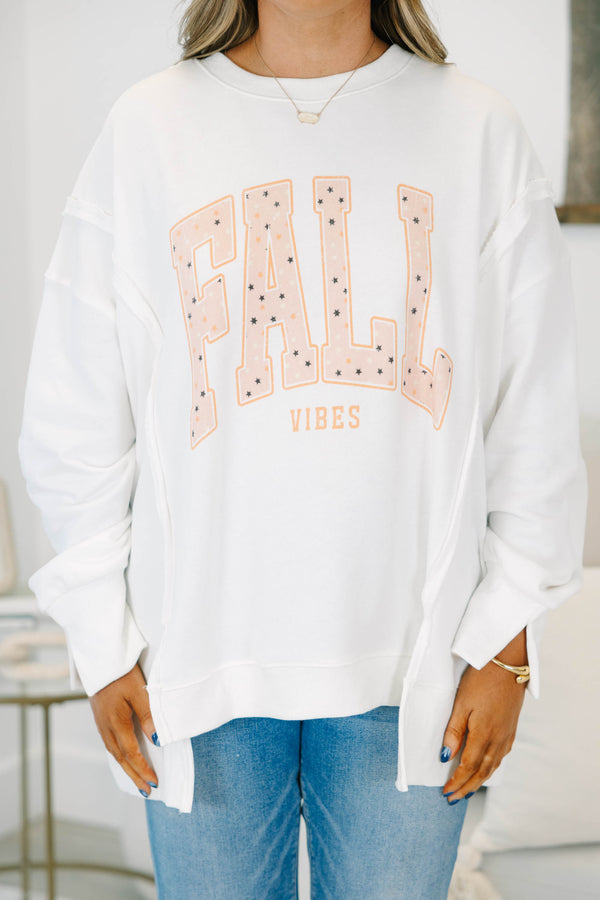 Plus Size ivory oversized crewneck sweatshirt with peach 'FALL VIBES' graphic and star details.