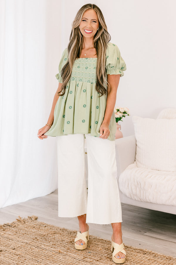 Chic Soul plus size clothing, short-sleeve ruffled puffed flowy pale sage green baby doll top with a square-neckline and a smocked bodice with a darker green subtle floral pattern 
