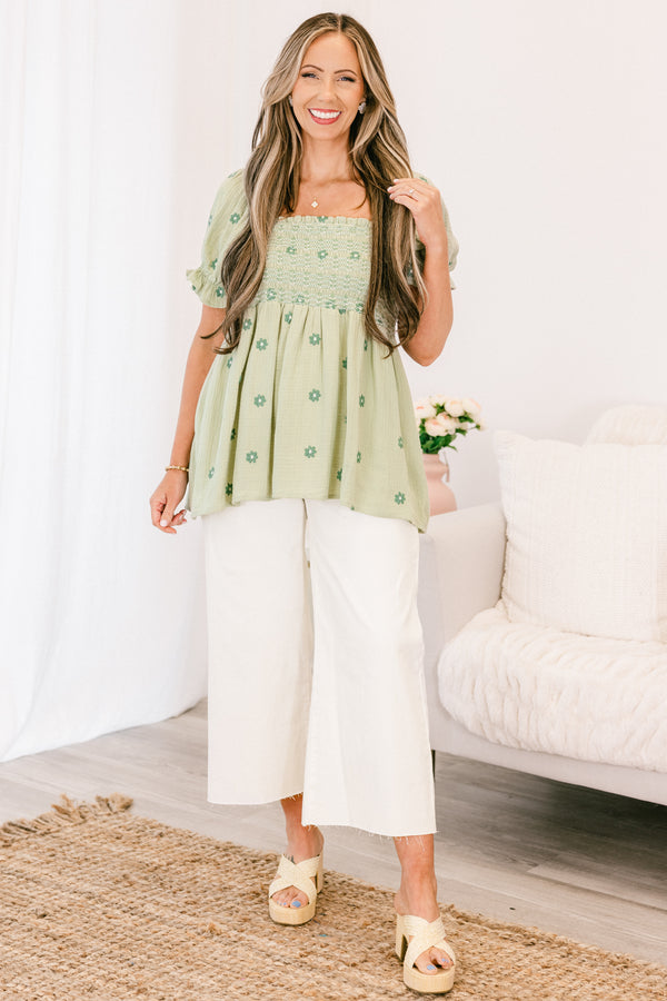 Chic Soul plus size clothing, short-sleeve ruffled puffed flowy pale sage green baby doll top with a square-neckline and a smocked bodice with a darker green subtle floral pattern 