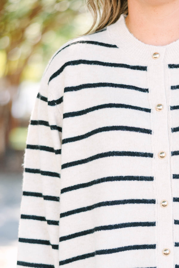 Plus Size oatmeal cardigan with black horizontal stripes, gold buttons, and a crew neckline.