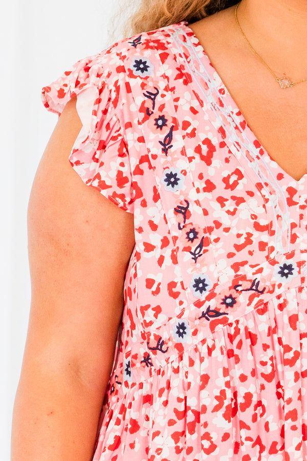 Plus Size pink leopard babydoll top with floral embroidery, ruffle sleeves, and a V-neckline.