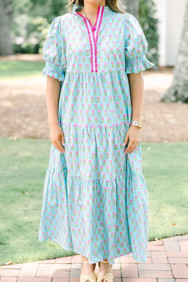 Plus size baby blue tiered maxi dress with pink floral print, ruffle sleeves, and a flowy fit.
