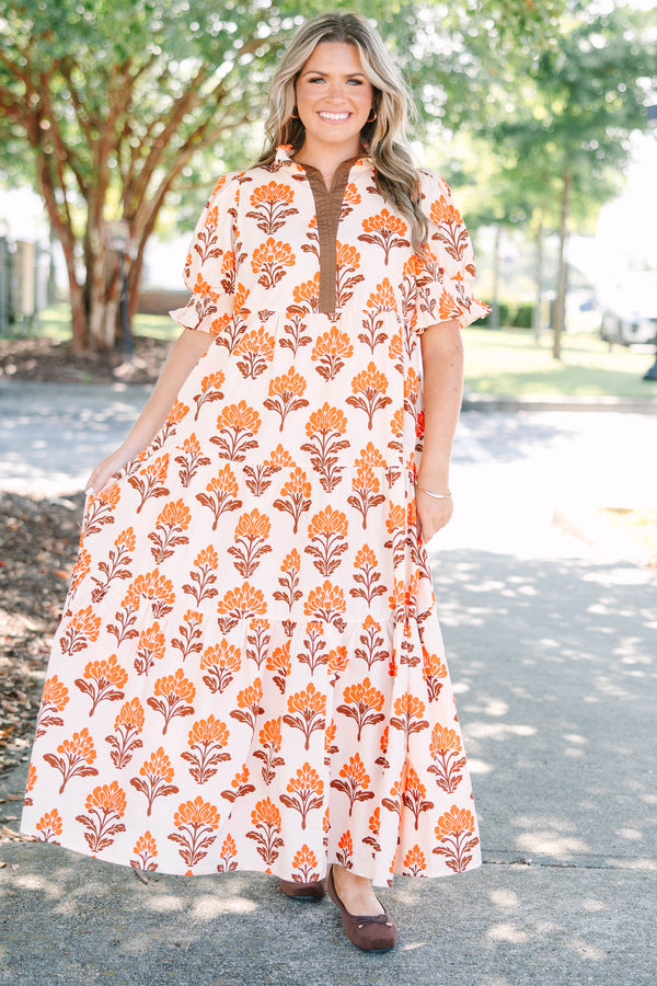 Plus Size orange floral tiered maxi dress with puff sleeves and a brown button-down neckline.