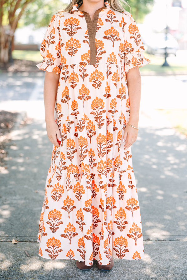 Plus Size orange floral tiered maxi dress with puff sleeves and a brown button-down neckline.