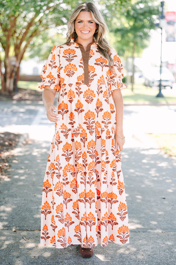 Plus Size orange floral tiered maxi dress with puff sleeves and a brown button-down neckline.