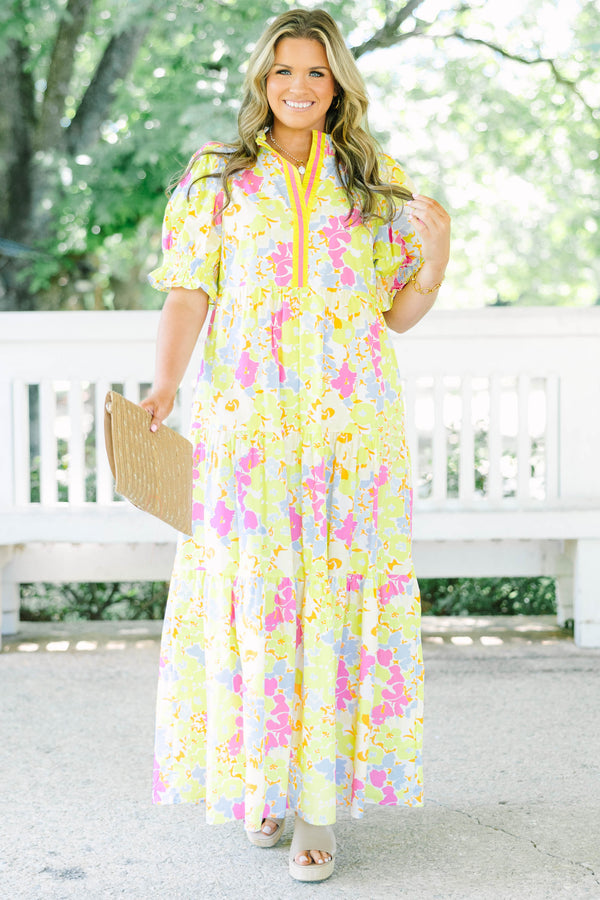 Plus Size yellow floral maxi dress with short puff sleeves, a tiered skirt, and a smocked collar.
