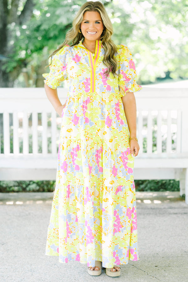 Plus Size yellow floral maxi dress with short puff sleeves, a tiered skirt, and a smocked collar.