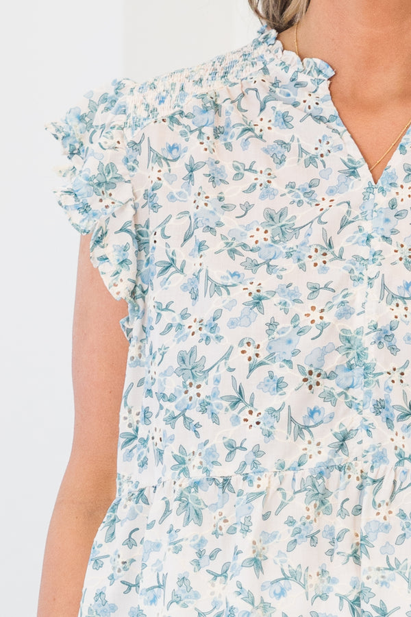 Chic Soul plus size clothing, white short sleeve eyelet floral top with v cutout along neckline with ruffle sleeves and blue eyelet floral design