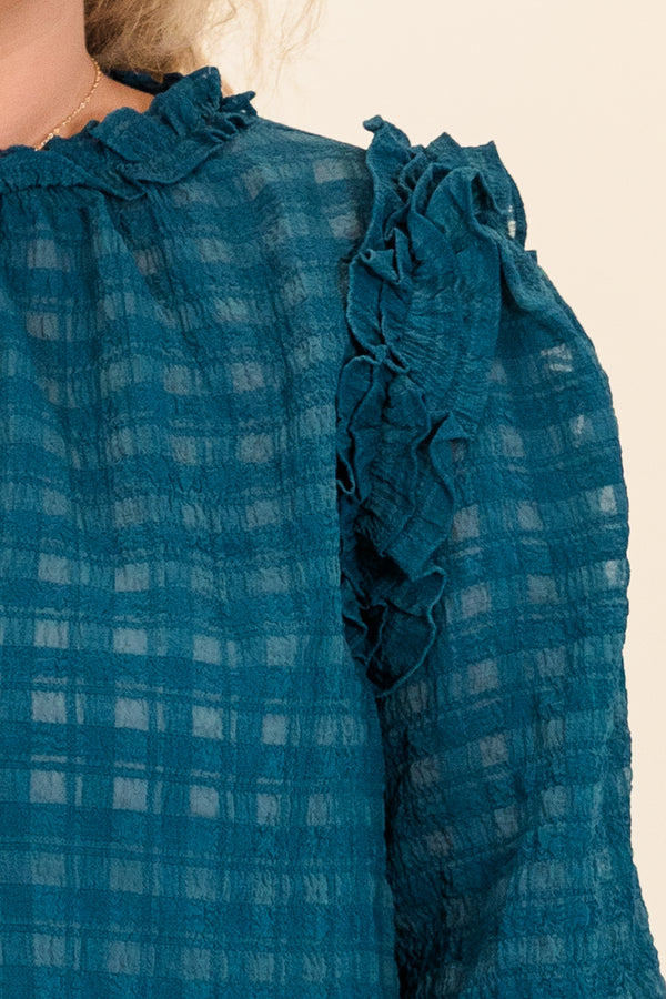 Chic Soul plus size clothing, long sleeve checkered material that is slightly see through with cuffed sleeves and ruffle detail along shoulders and neckline
