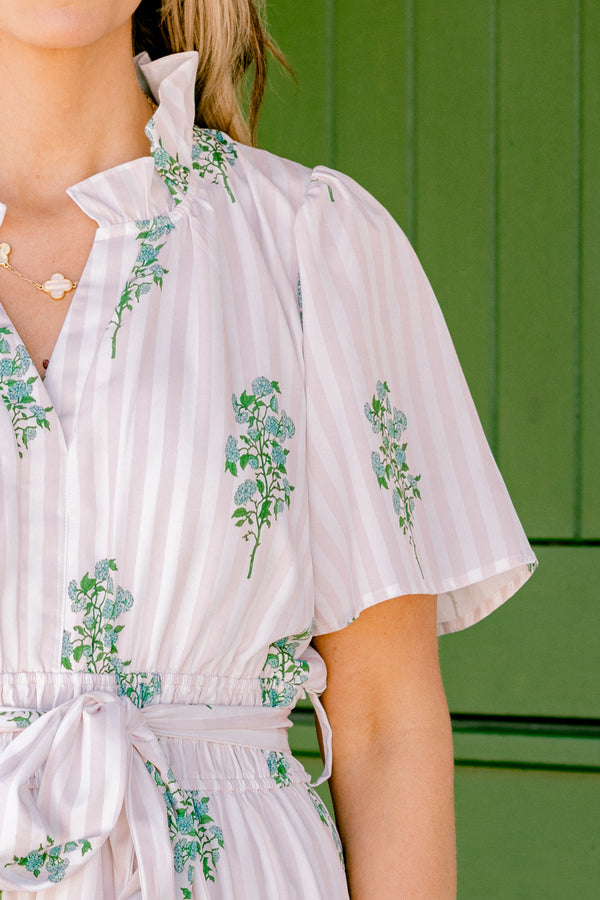 Chic Soul Plus size clothing, beige short sleeve maxi dress that has subtle stripes going down the dress and a floral green pattern as well as a bow that ties around the waist 