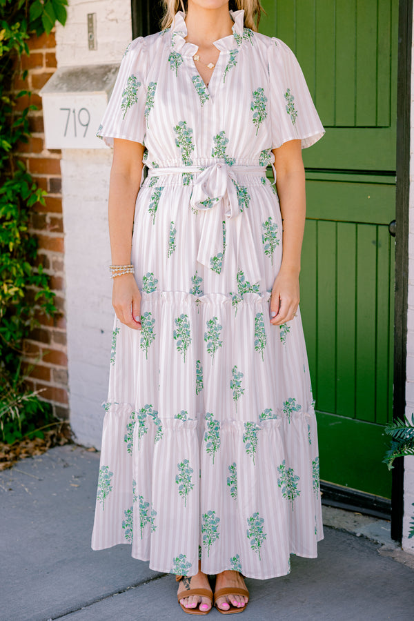 Chic Soul Plus size clothing, beige short sleeve maxi dress that has subtle stripes going down the dress and a floral green pattern as well as a bow that ties around the waist 