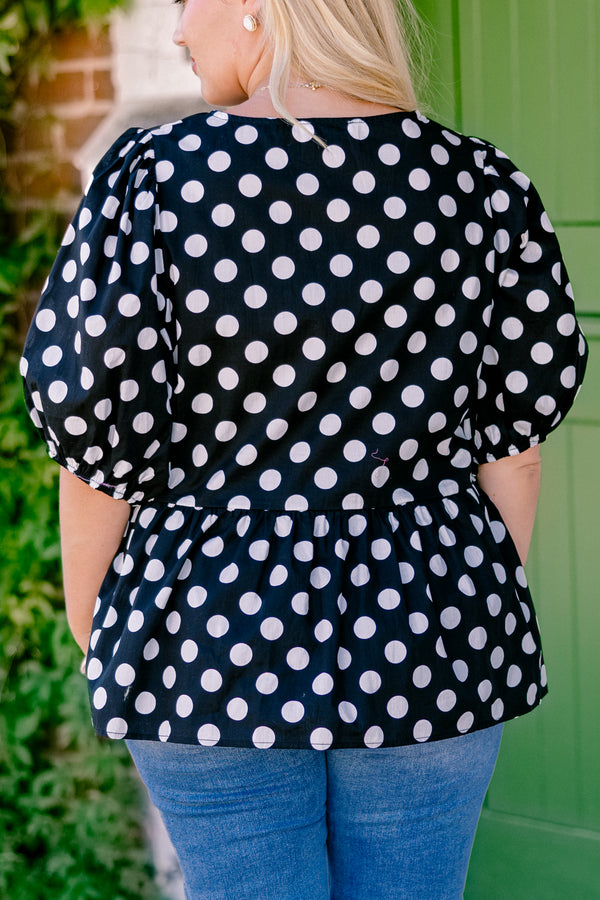 Chic Soul plus size clothing, black polka dot peplum top with bubble sleeves and there bows going down the center of the shirt