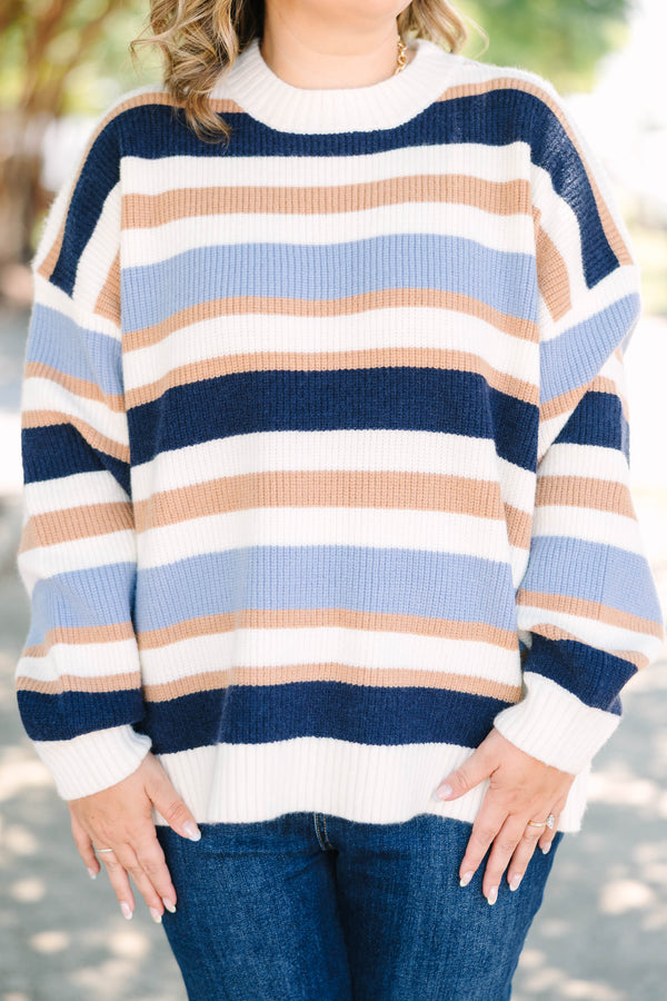 Plus Size oversized crewneck sweater with horizontal stripes in navy, light blue, tan, and white.