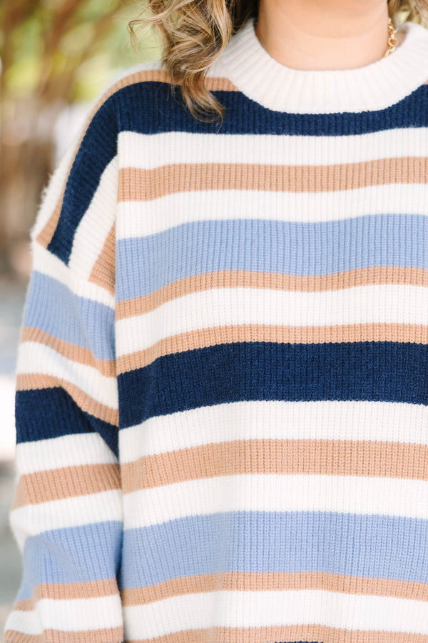 Plus Size oversized crewneck sweater with horizontal stripes in navy, light blue, tan, and white.