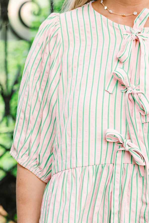 Chic Soul plus size clothing, pink short puff sleeve babydoll top with thin green vertical stripes and three bow ties along the front