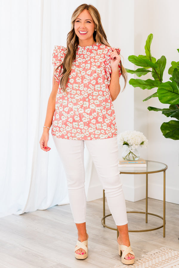 Plus Size peach floral print top with flutter sleeves and a high ruffled neckline.