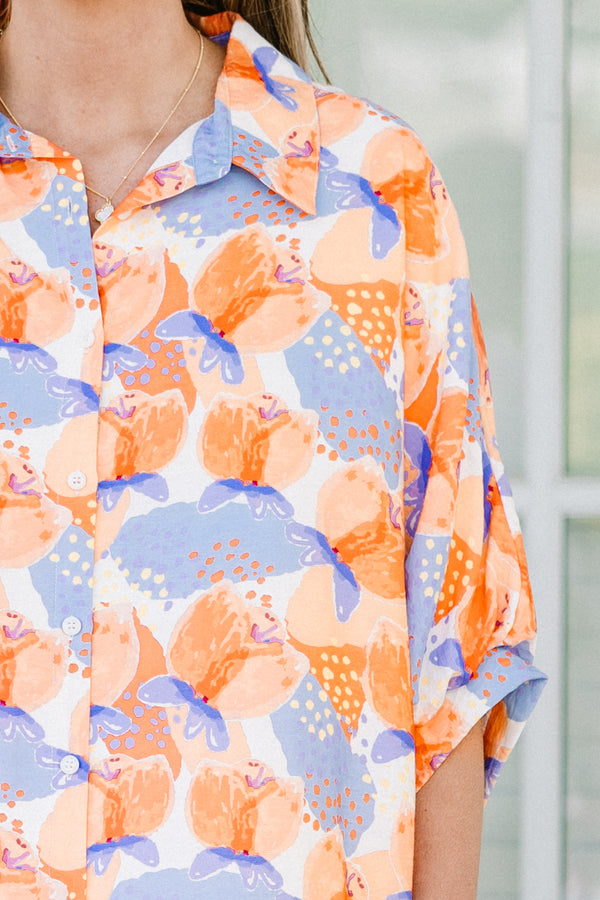 Chic soul plus size clothing, orange button-up top with a floral pattern and half sleeves 