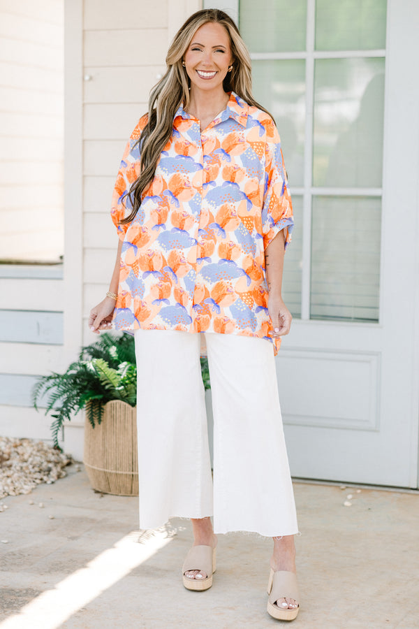 Chic soul plus size clothing, orange button-up top with a floral pattern and half sleeves 